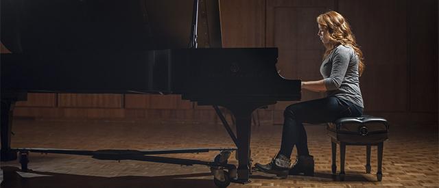 Young woman playing the piano